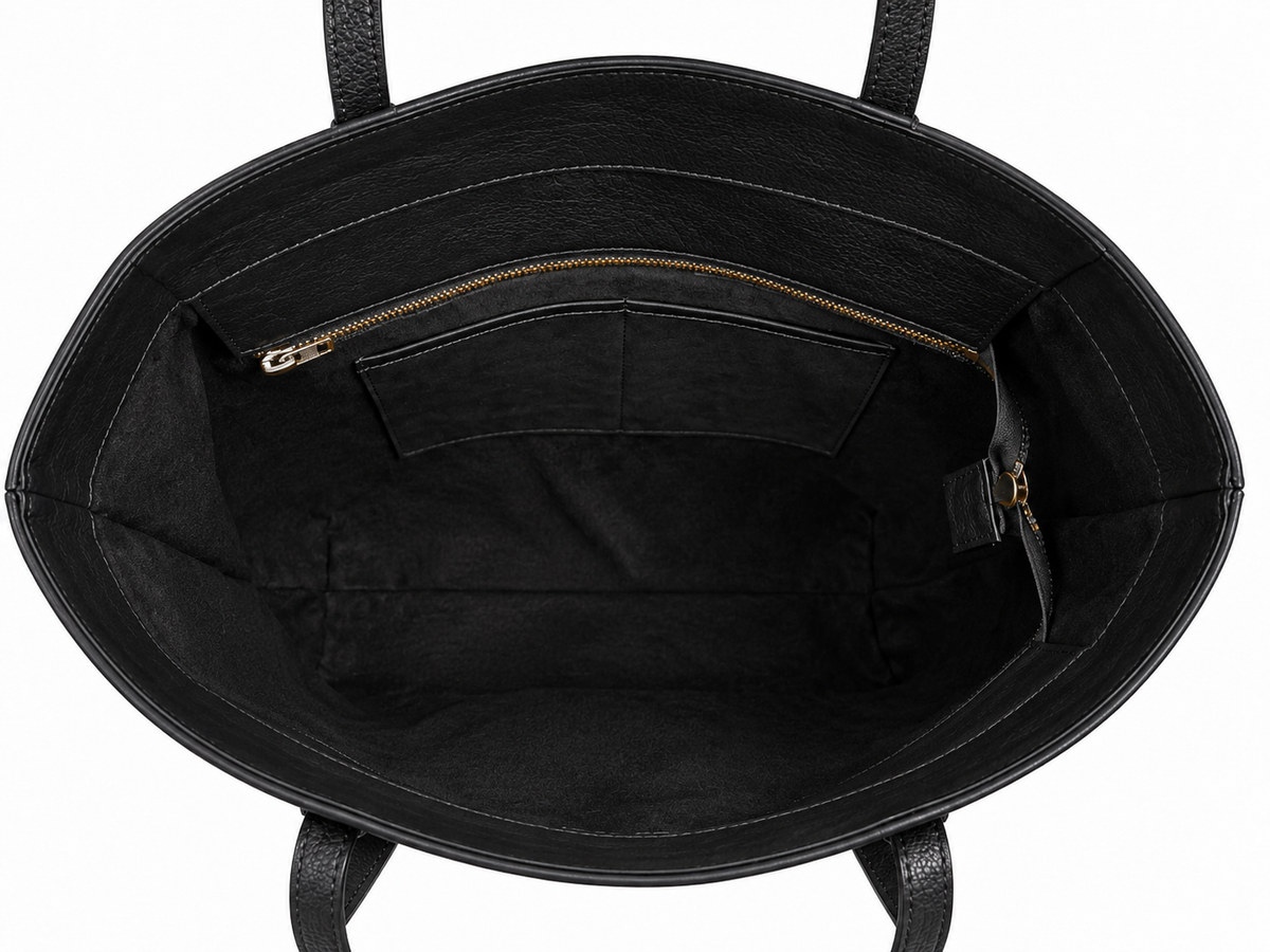 Interior y compartimentos de bolsa tote de piel negra AMZZUL